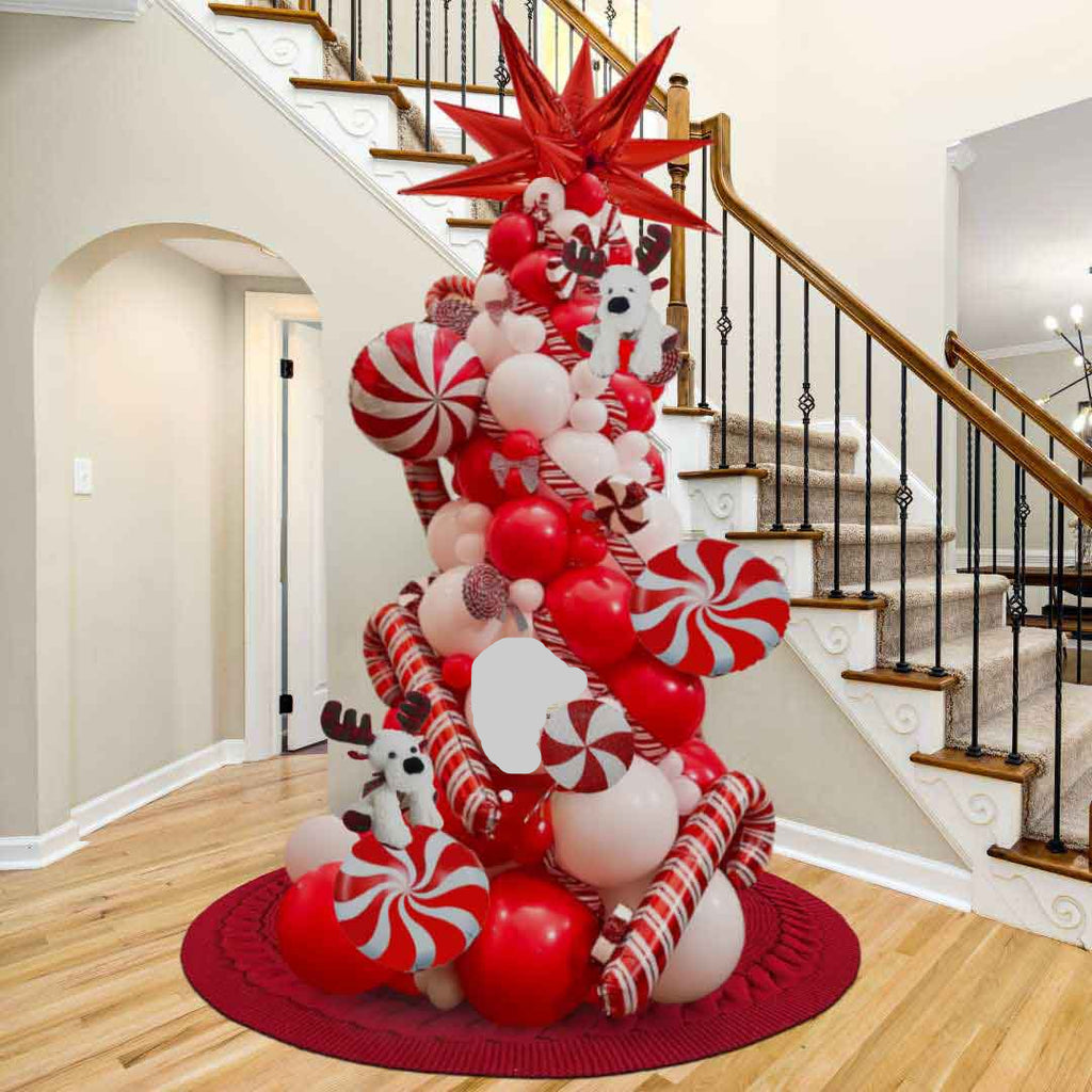Decorative Christmas balloon tree with red, white, candy can and peppermint candy balloons.